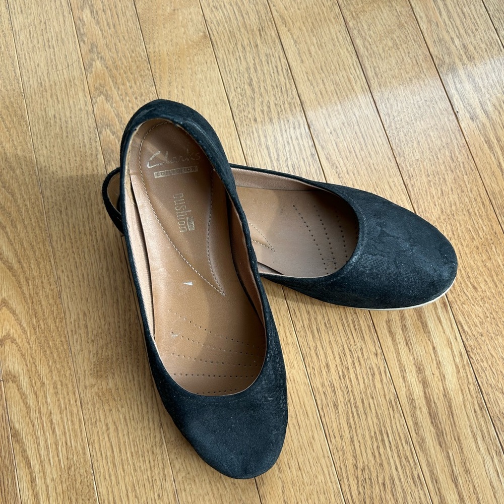 Clark’s flat casual shoes.